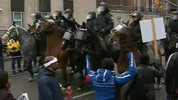 Mounted police in riot gear descend on protestors outside the U.S. Consulate on Thursday, Feb. 16, 2012. 