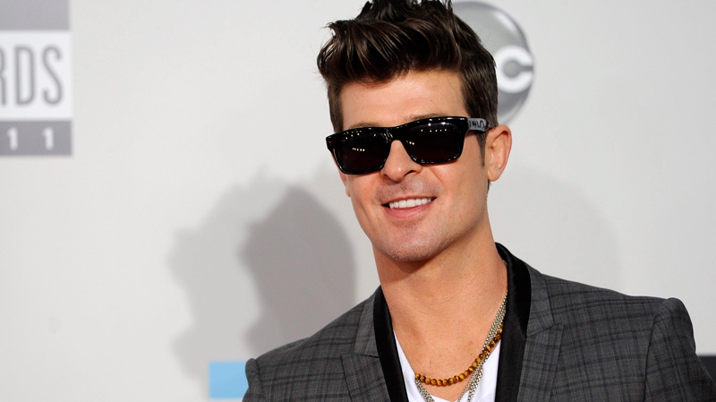 Robin Thicke arrives at the 39th Annual American Music Awards on Sunday, Nov. 20, 2011 in Los Angeles. (AP / Chris Pizzello)