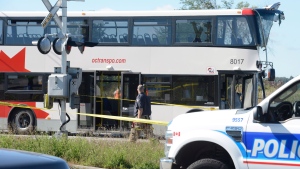  A city bus is seen following a collision with a Via Rail train in Ottawa's west end Wednesday, Sept. 18, 2013. (Adrian Wyld/The Canadian Press) 