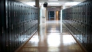 A empty hallway is seen at a school in this Sept. 5, 2014 file photo. (Jonathan Hayward / THE CANADIAN PRESS)