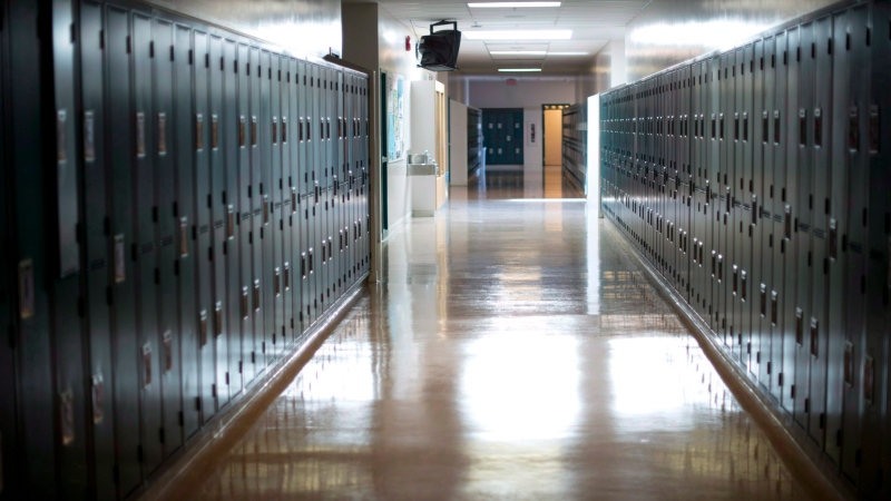 A empty hallway is seen at a school in this Sept. 5, 2014 file photo. (Jonathan Hayward / THE CANADIAN PRESS)