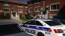 Ottawa Police Investigators tape off an area around a Vanier apartment building.  A man's body was found inside an apartment at 347 Lacasse Avenue. (Jim O'Grady/CTV Ottawa)