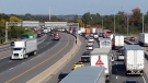 Many transport trucks are visible on Highway 401 westbound between the Highway 24 and Highway 8 exits on Friday, Sept. 26, 2014. (Dan Lauckner / CTV Kitchener)