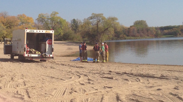 Paramedics on scene at St. Malo Provincial Park Beach, where the body of a man was pulled from the water on Saturday.