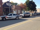 Police tape and cruisers surround a home after shots were fired in Windsor, Ont. on Monday, Sept. 29, 2014. (Rich Garton / CTV Windsor)