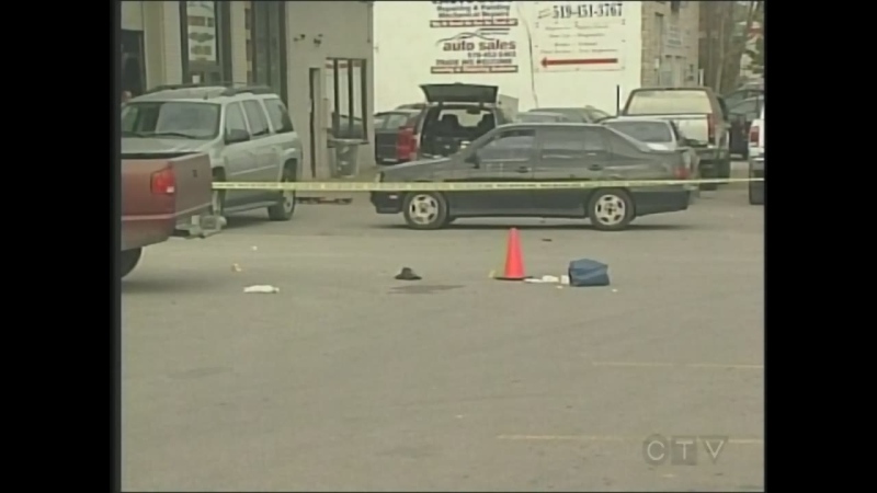Police tape marks the scene of the shooting death of Thi Tran in London, Ont. on Oct. 11, 2011.