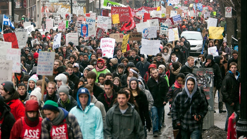 Students march through the downtown streets during a demonstration against higher tuition fees Thursday, February 23, 2012 in Montreal. (Ryan Remiorz / THE CANADIAN PRESS)