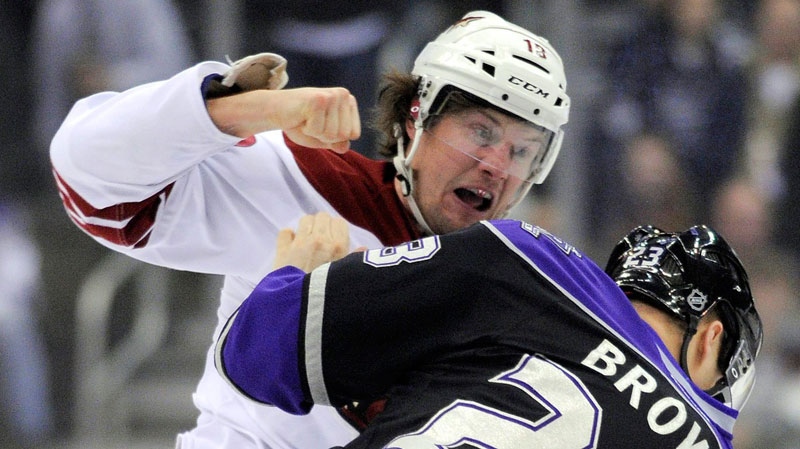 Phoenix Coyotes left wing Shane Doan, left, and Los Angeles Kings right wing Dustin Brown fight during the first period of an NHL hockey game in Los Angeles on Thursday, Feb. 16, 2012. (AP / Mark J. Terrill)
