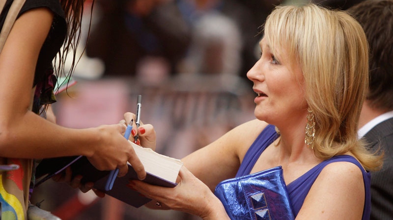 British author JK Rowling signs autographs as she arrives for the World Premiere of Harry Potter and the Half-Blood Prince, at a cinema in Leicester Square, central London on July 7, 2009. (AP / Joel Ryan)