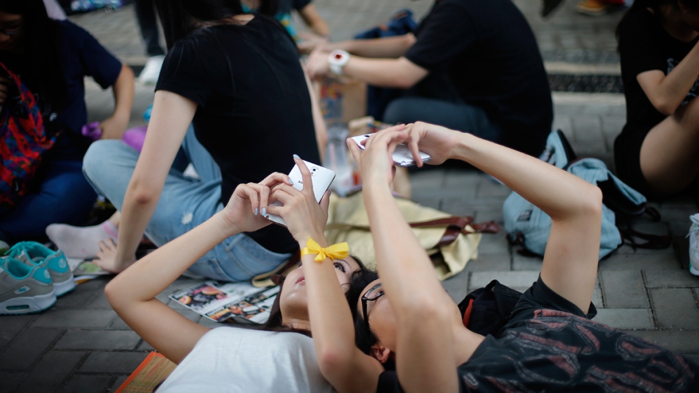 Activists use their smartphones in Hong Kong