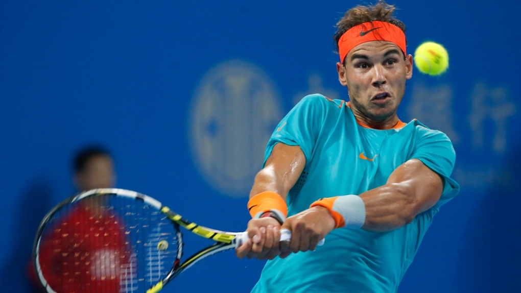 Rafael Nadal returns a shot at the China Open
