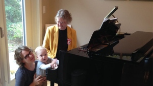 Patricia Martens (seated at piano) with her daughter Becky and her grandson Alex.