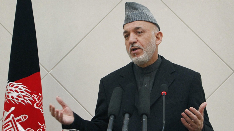Afghan President Hamid Karzai speaks during a press conference at the presidential palace in Kabul, Afghanistan, Sunday, Feb. 26, 2012. (AP Photo/Musadeq Sadeq)
