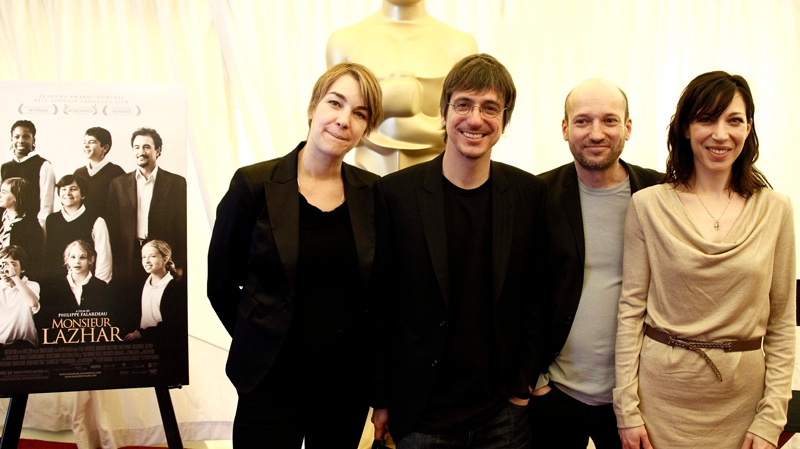 From left, producer Kim McCraw, director Philippe Falardeau, producer Luc Dery and actress Evelyne de la Cheneliere, from the film "Monsieur Lazhar" from Canada, poses with during the press availability for the Foreign Language Film Academy Award nominees in Los Angeles, Friday, Feb. 24, 2012. The 84th Academy Awards will be held on Sunday. (AP Photo/Matt Sayles)
