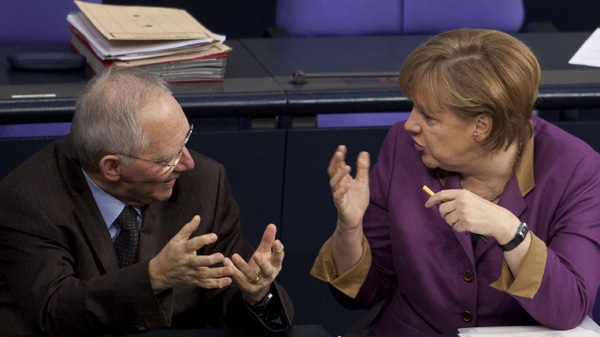 German Chancellor Angela Merkel, right, talks with Finance Minister Wolfgang Schaeuble during the debate prior to the voting of the German Parliament Bundestag about a new Greek rescue package in Berlin, Germany, Monday, Feb. 27, 2012. (AP / Markus Schreiber)