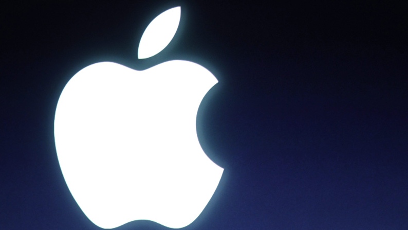 In this Tuesday, Oct. 4, 2011 file photo and Apple logo is seen during an announcement at Apple headquarters in Cupertino, Calif. (AP Photo/Paul Sakuma, file)