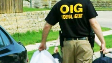 U.S. federal heath department officials remove evidence from the office of Canadian Dr. Jacques Roy in Dallas on Wednesday, Feb. 29, 2012. 