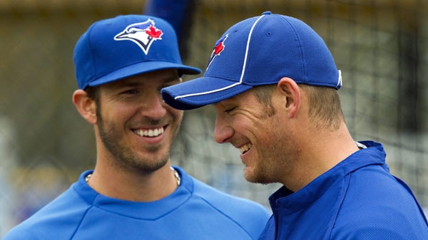 Toronto Blue Jays catchers J.P Arencibia and Jeff Mathis (right) share a laugh at Jays Spring Training in Dunedin, Fla. on Sunday February 26, 2012. THE CANADIAN PRESS/Frank Gunn