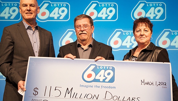 Rene and Suzanne Longpre of Limoges, Ont. are presented with a cheque for $11.5 million at the OLG Prize Centre Thursday. (Supplied photo)