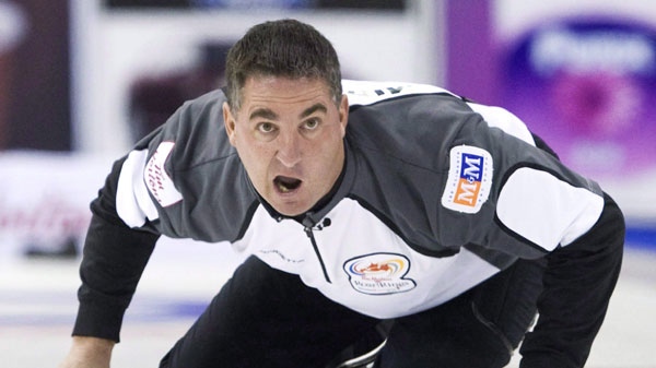 Skip Wayne Middaugh yells after throwing his rock while playing against Team Howard during the 2009 Canadian Olympic Curling Trials in Edmonton on Monday, Dec. 7, 2009. THE CANADIAN PRESS/Nathan Denette