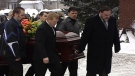 Loved ones carry the casket of Patrick Robinson at his funeral on Friday, March 2, 2012. 