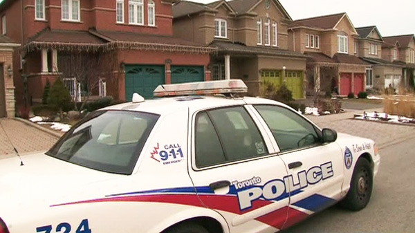 Police investigate after a body was discovered at a home in the Warden Avenue and Huntingwood Drive area on Friday, March, 2, 2012.