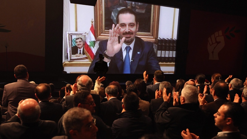 Former Lebanese Prime Minister Saad Hariri speaks via a video link from Paris, during a ceremony to mark the seventh anniversary of the assassination of his father, former Prime Minister Rafik Hariri, in Beirut, Lebanon, Tuesday, Feb. 14, 2012. (AP / Bilal Hussein)