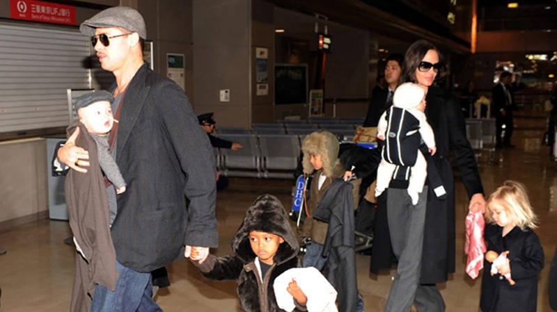 U.S. actor Brad Pitt and actress Angelina Jolie with children arrive at Narita International Airport in Narita, east of Tokyo, Japan, Tuesday, Jan. 27, 2009.