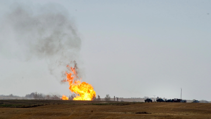 Remaining gas is burned off after an explosion and fire at a gas pumping station owned by TransGas near Prud'homme, Sask., Saturday, October 11, 2014. THE CANADIAN PRESS/Liam Richards