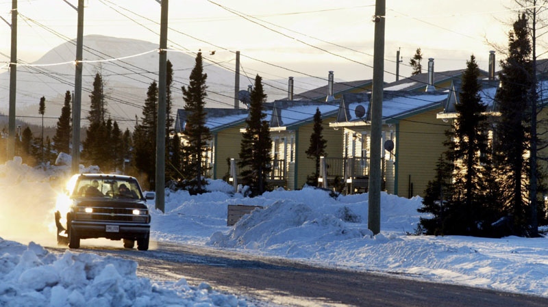 Innu residents of the Labrador community of Natuashish, Nfld. head through town on Tuesday, Dec. 2, 2003.