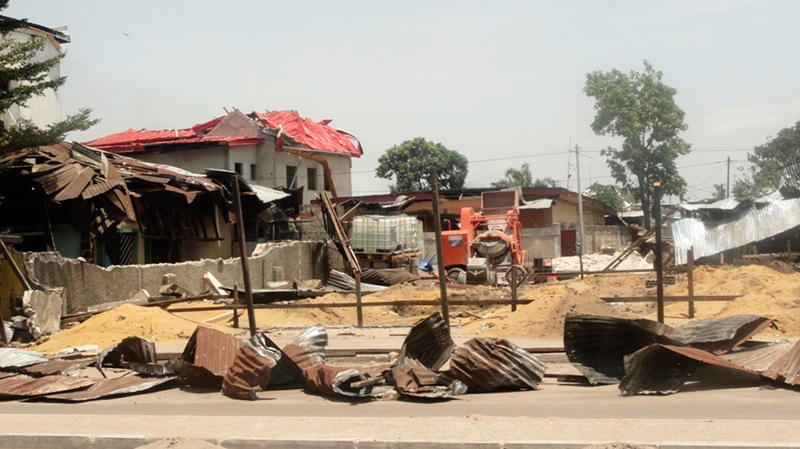 Debris from blast-damaged homes are seen in the Ouenze neighborhood after multiple explosions occurred at a munitions depot, in Brazzaville, Republic of Congo Sunday, March 4, 2012. 