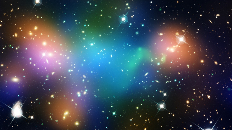 This composite image shows the distribution of dark matter (blue), galaxies, starlight from the galaxies (orange) and hot gas (green) in the core of the merging galaxy cluster Abell 520, formed from a violent collision of massive galaxy clusters.  The image makes use of data from the Hubble Space Telescope, the Canada-France-Hawaii Telescope in Hawaii, and the NASA's Chandra X-ray Observatory. (NASA, ESA, CFHT, CXO, M. J. Jee (University of California, Davis), and A. Mahdavi (San Francisco State University, California))