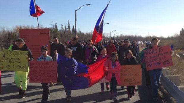 More than 100 protesters from the Cross Lake First Nation north of Lake Winnipeg marched to the hydro dam Wednesday and some have refused to leave the grounds.