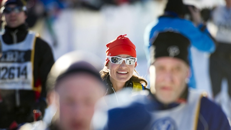 Britain's Pippa Middleton, center, sister of Catherine, Duchess of Cambridge, reaches the finish line of the 88th Vasaloppet cross country ski marathon in Mora, Sweden, Sunday March 4, 2012. (AP Photo/Ulf Palm)