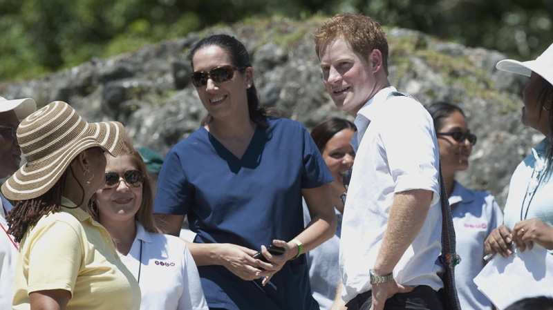 Britain's Prince Harry, center right, visits the Mayan temple at Xunantunich , Belize, on the second day of his ten-day tour to Belize, Bahamas, Jamaica, and Brazil Saturday March 3, 2012. (AP Photo/Mark Large/Daily Mail /PA Wire) 
