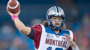 Montreal Alouettes quarterback Jonathan Crompton launches a pass against the Toronto Argonauts during first half CFL action in Toronto on Saturday October 18, 2014. THE CANADIAN PRESS/Frank Gunn