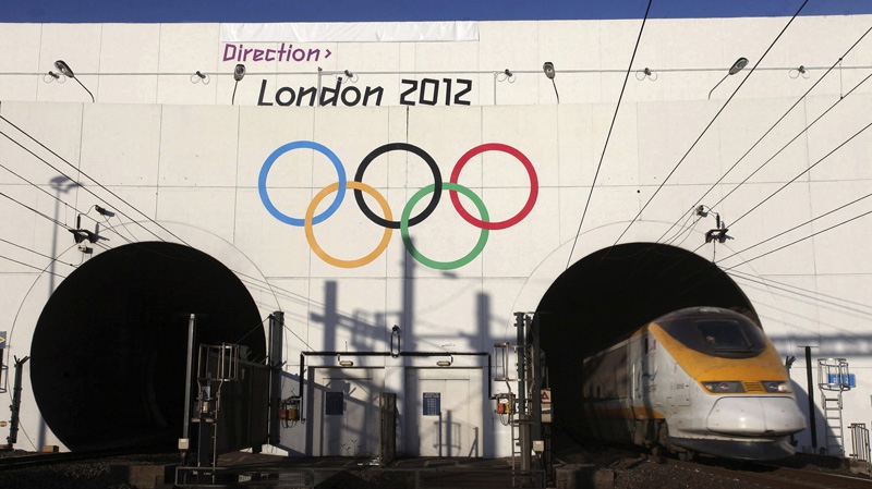In this undated photo provided on Monday, Dec. 19, 2011 by the London Organizing Committee of the Olympic Games, a Eurostar train is seen at the entrance to the Channel Tunnel, which is adorned with the Olympic Rings to advertise the 2012 London Olympics in Coquelles, near Calais, northern France. (AP Photo/LOCOG)