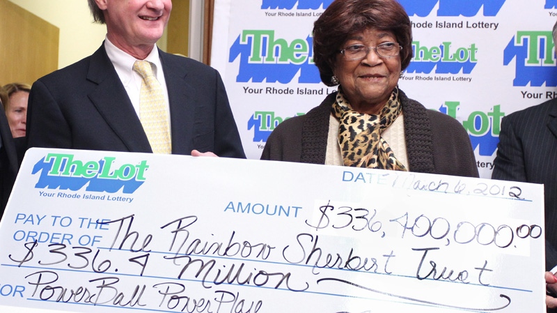 Louise White, right, 81 from Newport, R.I., is presented a check for $336 million at Rhode Island Lottery headquarters in Cranston, R.I., Tuesday, March 6, 2012. (AP / Stew Milne) 
