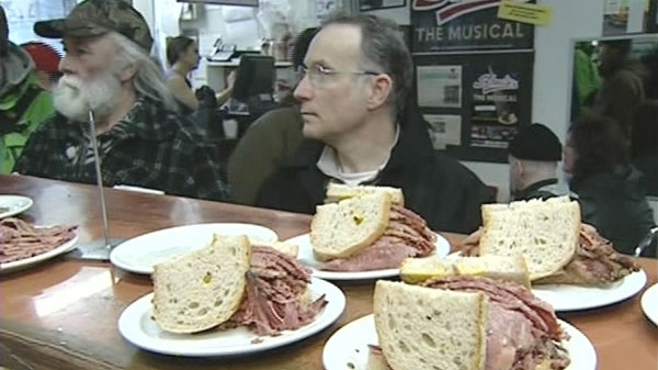 A patron waits in line at Schwartz's Deli in Montreal on Tuesday, March 6, 2012.