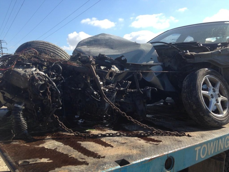 A Nissan Sentra involved in a collision with a freight train in Lakeshore, Ont. can be seen on Wednesday, Oct. 22, 2014. (Rich Garton/ CTV Windsor)