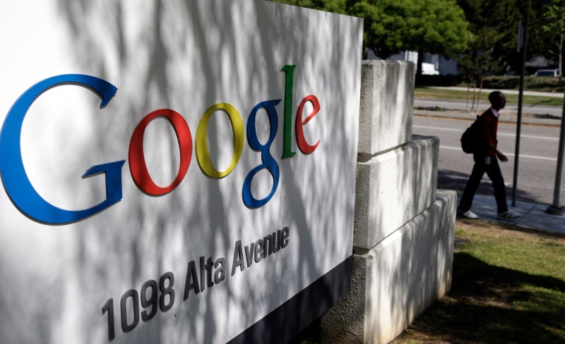 A man walks past a Google sign at the company's headquarters in Mountain View, Calif. on June 5, 2014 (AP / Marcio Jose Sanchez)