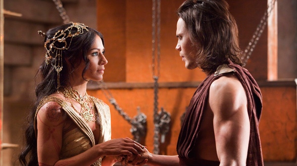 Lynn Collins, left, and Taylor Kitsch are shown in a scene from Disney's 'John Carter.'