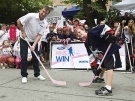 Hockey legend Wayne Gretzky, left, and Blake Strong, 10, of the Clarington Toros pose for a photograph before hitting the street for the inaugural Ford of Canada Pins to Win charity Street Hockey Tournament on Saturday, Sept. 13, 2008 in Toronto. (THE CANADIAN PRESS/Nathan Denette)