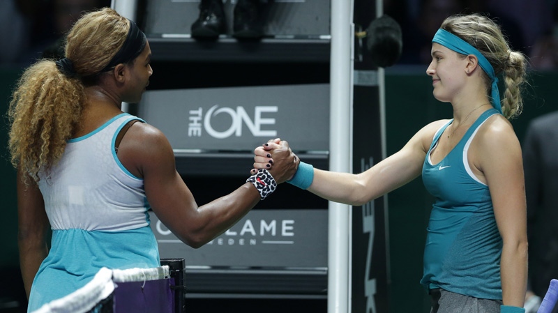 Serena Williams, left, of the US is congratulated 