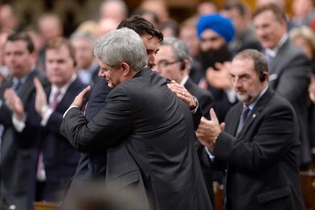 Harper and Trudeau hug in Parliament