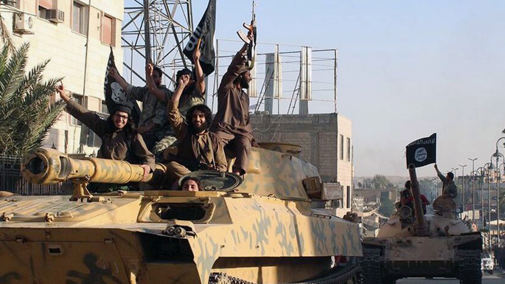 Islamic State militants parade through Syria