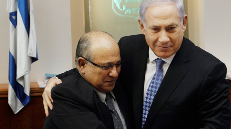 Israeli Prime Minister Benjamin Netanyahu, right, hugs Meir Dagan, then outgoing Mossad chief, after thanking him at the beginning of the weekly cabinet meeting in Jerusalem, Jan. 2, 2011. (AP / Ronen Zvulun, Pool, File)