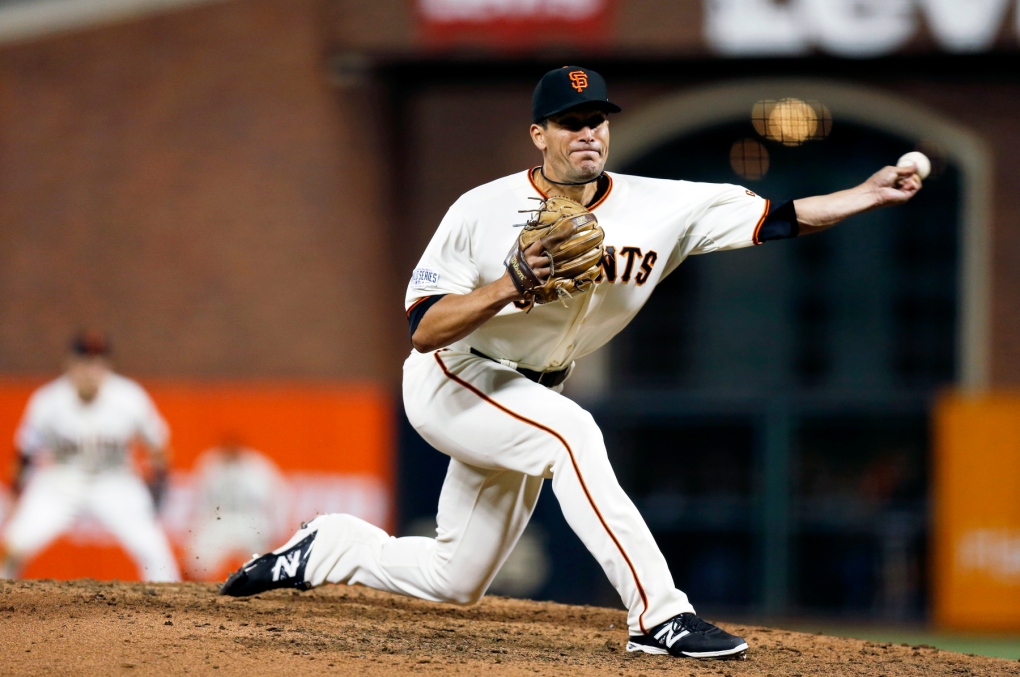 Giants pitcher Javier Lopez throws during Game 3