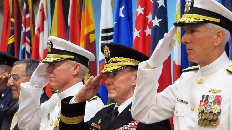 From left Defense Secretary Leon Panetta, outgoing Pacific Command commander Adm. Robert Willard, Chairman of the Joint Chiefs of Staff Gen. Martin Dempsey, and incoming Pacific Command commander Adm. Samuel Locklear salute at a change of command ceremony Friday, March 9, 2012 at Camp Smith, in Honolulu. 
