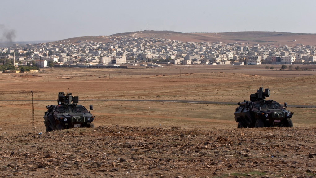 Turkish military vehicles outside Suruc